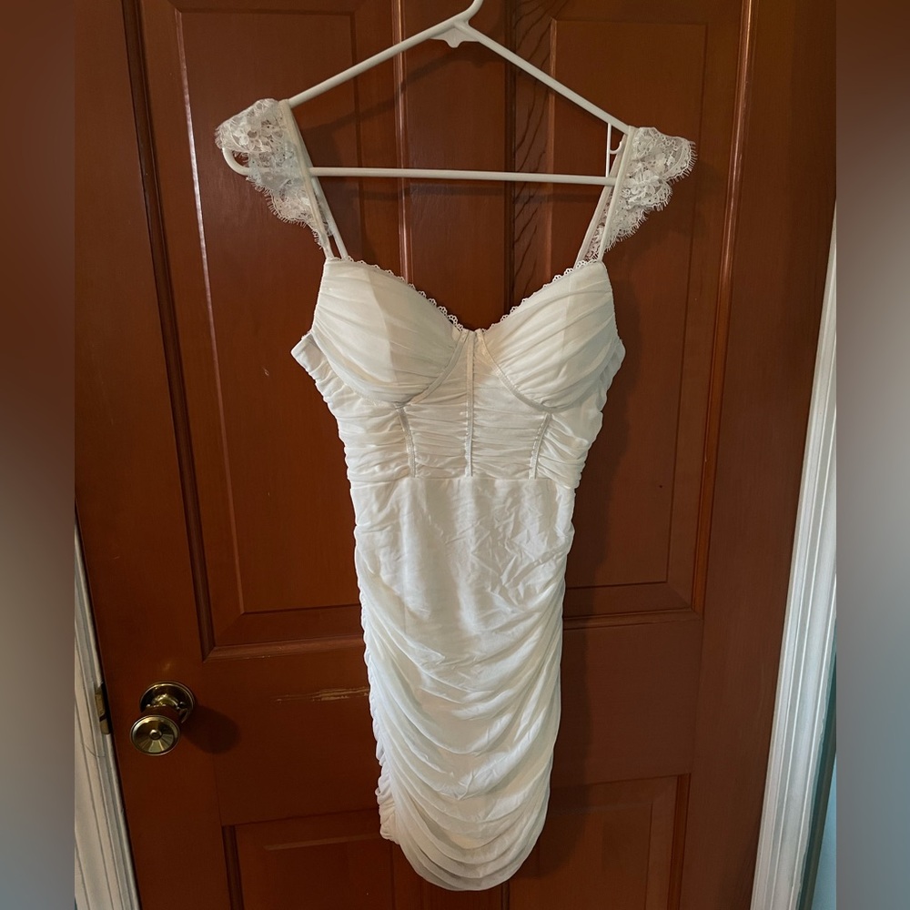 White corset mini dress with lace sleeve detail